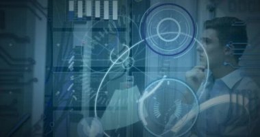 Animation of 5g text, scopes scanning, data processing over caucasian male it engineer and servers. Global connections, data processing and digital interface concept digitally generated video.