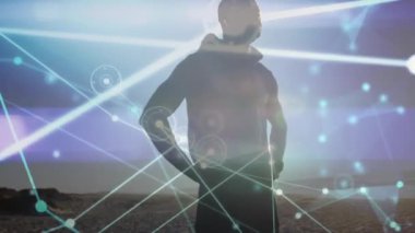 Sahildeki Afro-Amerikan erkeğinin üzerindeki simgelerle olan bağlantıların animasyonu. Küresel spor ve dijital arayüz kavramı dijital olarak oluşturulmuş video.