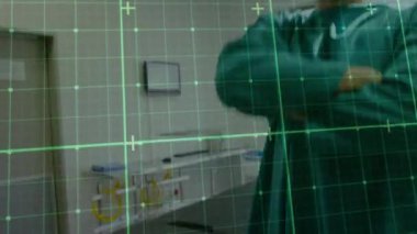 Animation of grid network over caucasian male surgeon with arms crossed smiling at hospital. Medical healthcare and technology concept