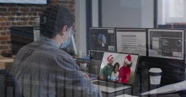 Animation of statistical data processing over caucasian man having a videocall on laptop at office. Global networking and business technology concept