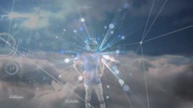 Animation of data processing and clouds over caucasian rugby player. Global business and digital interface concept digitally generated video.