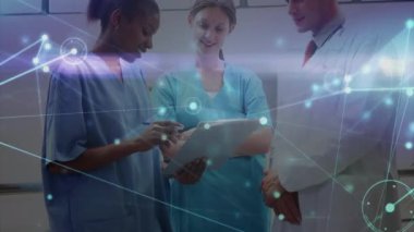 Animation of network of connections and light trails over diverse doctors. Global medicine, healthcare and digital interface concept digitally generated video.