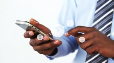 Animation of connections over hands of african american man using smartphone. Network, connections, communication and technology concept digitally generated video.