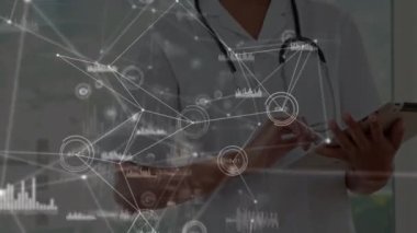 Animation of network of connections over indian female doctor using digital tablet. Medical healthcare and technology concept