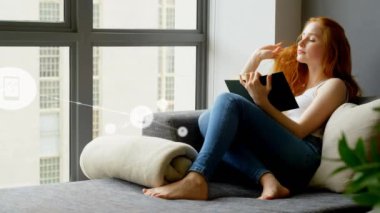 Animation of network of connections with icons over caucasian woman reading. Social media and digital interface concept digitally generated video.