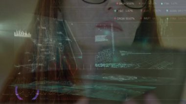 Animation of financial data and statistics over caucasian woman using tablet. Global business, finances and data processing concept digitally generated video.