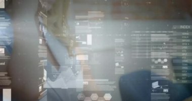 Animation of data processing over caucasian businesswoman talking on smartphone. Global business and digital interface concept digitally generated video.