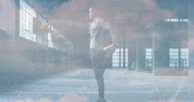 Animation of clouds over african american sportsman stretching. Global business and digital interface concept digitally generated video.
