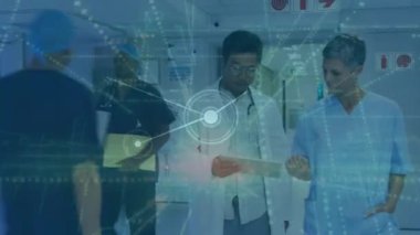 Animation of network of connections and light trails over diverse doctors. Global medicine, healthcare and digital interface concept digitally generated video.