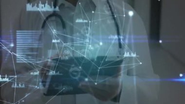 Animation of network of connections over caucasian senior male doctor using digital tablet. Medical healthcare and technology concept