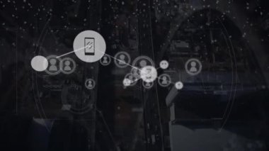 Animation of network of connections with icons and scope scanning over cityscape. Global connections, computing and digital interface concept digitally generated video.