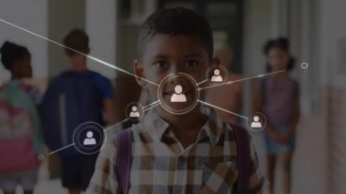 Animation of network of connections with icons over diverse schoolchildren. Global education, connections and digital interface concept digitally generated video.