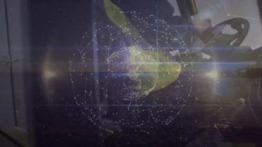 Animation of spots and globe over caucasian male worker. Global business and digital interface concept digitally generated video.