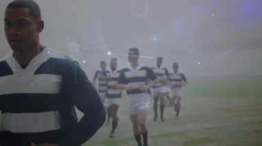 Animation of network of connections over team of diverse male rugby players running on sports field. Global networking and sports technology concept