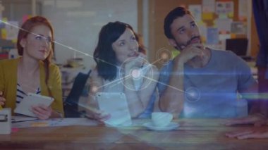 Animation of network of connections over diverse office colleagues discussing at office. Global networking and business technology concept