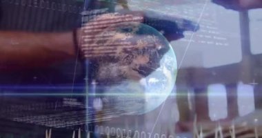 Animation of stock market data processing over mid section of woman making a payment by credit card. Digital payment and business technology concept