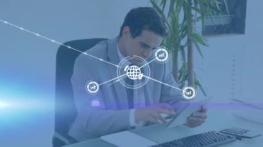 Animation of network of connections with icons over biracial businessman using tablet. Global education and digital interface concept digitally generated video.