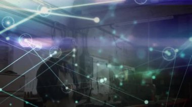 Animation of network of connections over caucasian male worker using tablet. Global business and digital interface concept digitally generated video.