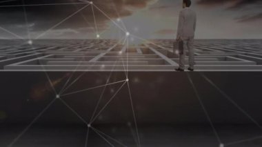 Animation of network of connections over caucasian businessman and maze. Global connections, computing and digital interface concept digitally generated video.