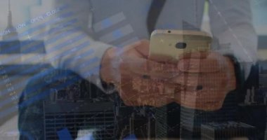 Animation of statistics and financial data processing over caucasian man using smartphone. Global business, connections, networks and data processing concept digitally generated video.