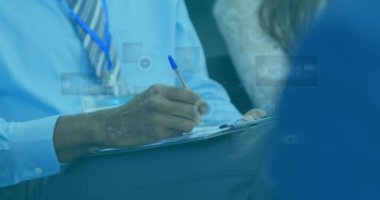 Animation of data processing and round scanners over mid section of businessman writing on clipboard. Computer interface and business technology concept