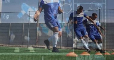 Animation of screen with biological data over diverse male soccer players during training. Sport, soccer, durability and technology concept digitally generated video.
