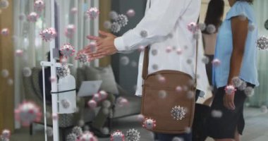 Animation of falling covid 19 cells over watting room. Global covid 19 pandemic, science and connections concept digitally video.