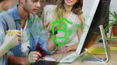 Animation of security padlock icon over diverse colleagues discussing together at office. Cyber security and business technology concept