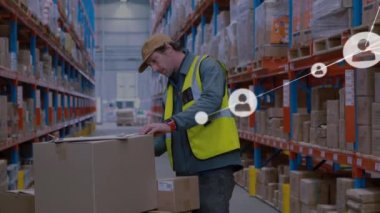Animation of networks of connection with people icons over caucasian man working in warehouse. Global shipping, business, connections, networks and data processing concept digitally generated video.