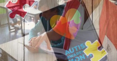 Animation of autism awareness month text over diverse schoolchildren and teacher using tablet. autism awareness month and celebration concept digitally generated video.