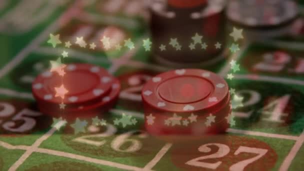 Animation of glowing star shaped fairy lights against red dice over stack of casino poker chips. Casino and gambling concept Видеоклип