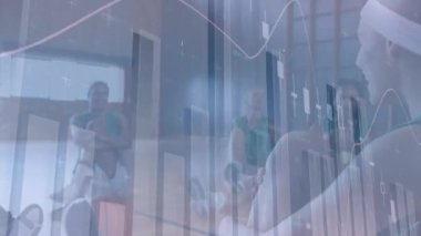 Animation of financial data processing over diverse basketball players and cityscape. global business, sport and data processing concept digitally generated video.