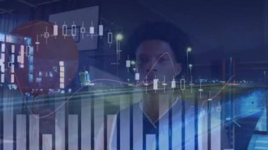 Animation of financial data processing over african american basketball player and cityscape. global business, sport and data processing concept digitally generated video.
