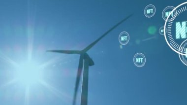 Animation of falling nft icons over windmill. Global connections, data processing and digital interface concept digitally generated video.
