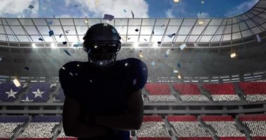 Confetti falling over male rugby player wearing a helmet against sports stadium. sports and tournament concept