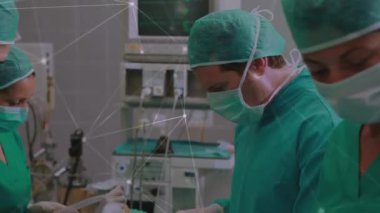 Animation of connections over team of diverse surgeons during operation. Health, medicine, connections and technology concept digitally generated video.