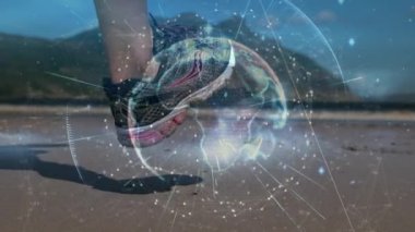 Animation of globe, rays, molecule, caucasian runner with sports shoes running at beach. Digital composite, multiple exposure, digital interface, technology, global science, wellbeing, leisure time.