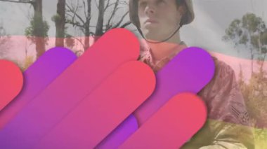 Animation of flag of germany over caucasian male soldier with armor. Army, soldiers and patriotism concept digitally generated video.