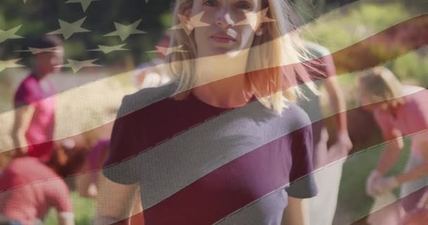 Composite Video American Flag Portrait Caucasian Female Volunteer Smiling Forest — Stockvideo
