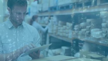 Animation of graphs over caucasian male warehouse worker. Business, finance and delivery services concept digitally generated video.