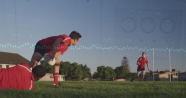 Animation of graphs over diverse male soccer players during training. Sport, soccer, finacne and technology concept digitally generated video.