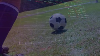 Animation of graphs and financial data over legs of male soccer player with ball on field. Sport, soccer, finance and economy concept digitally generated video.
