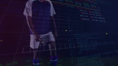 Animation of graphs and financial data over legs of male soccer player with ball on field. Sport, soccer, finance and economy concept digitally generated video.