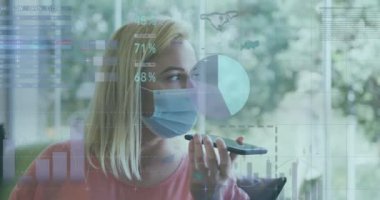 Animation of data processing over caucasian women wearing face mask using smartphone. Global science, connections, data processing and digital interface concept digitally generated video.