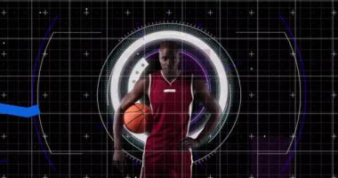 Graphs moving over portrait of african american male basketball player against round scanner. sports and technology concept