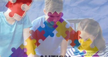 Animation of autism awareness month text over diverse schoolchildren using tablet. autism awareness month and celebration concept digitally generated video.