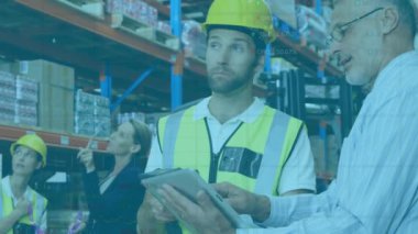 Animation of graphs over caucasian male warehouse workers. Business, finance and delivery services concept digitally generated video.