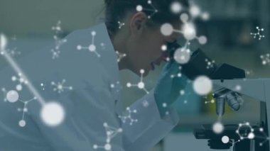Animation of molecules over caucasian scientist in lab. global science, computing and digital interface concept digitally generated video.