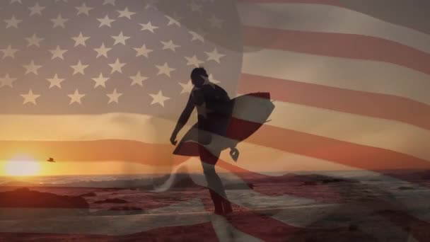 Composite Video Waving American Flag Rear View Man Walking Surfboard — Stockvideo