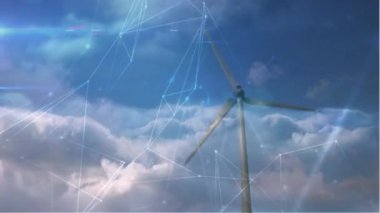Animation of network of connections over spinning windmill against clouds in the blue sky. Global networking and renewable energy technology concept